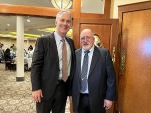 Two men, Mayor Jon Mitchell and Rev. David Lima, pose for the camera.