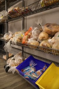 Shelves full of bread in the PACE food center.